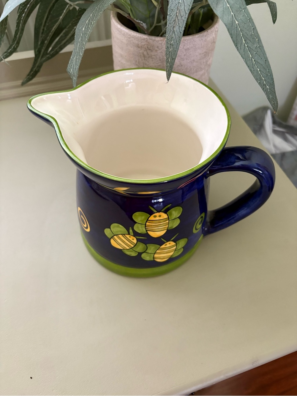 Laurie Gates Vintage Blue Ceramic Pitcher
with Yellow Bee